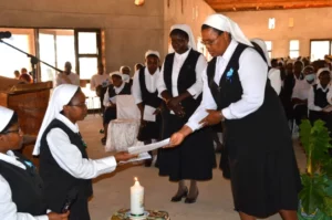 sr.-monica-madyembwa-receives-letters-of-commitment-from-the-newly-professed-sisters.-1.webp